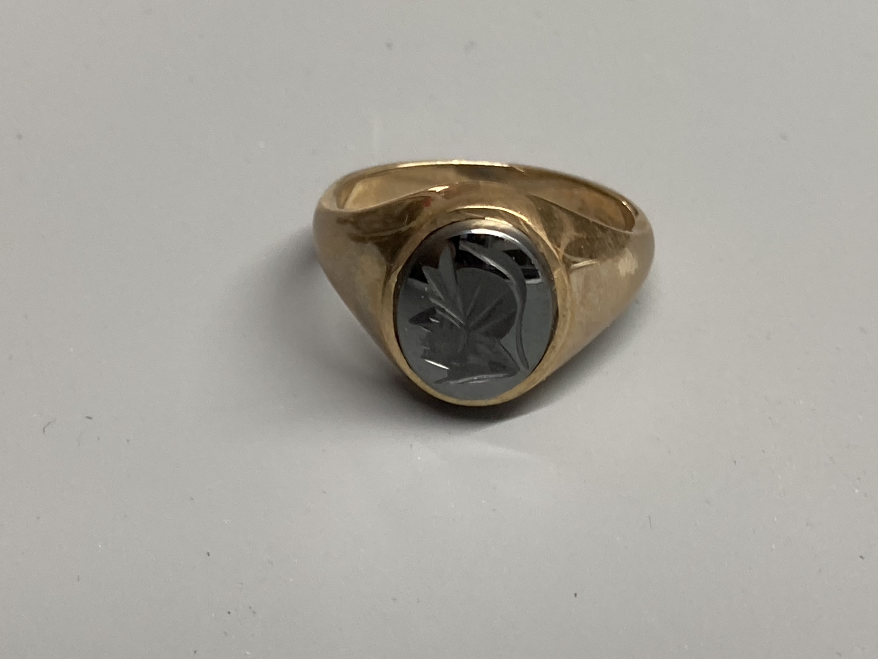 Two modern 9ct gold and bloodstone set signet rings, sizes M & T and a 9ct gold and hematite ring, size S/T
